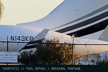 Tail detail from the footage: N143K and one letter half hidden by the winglet